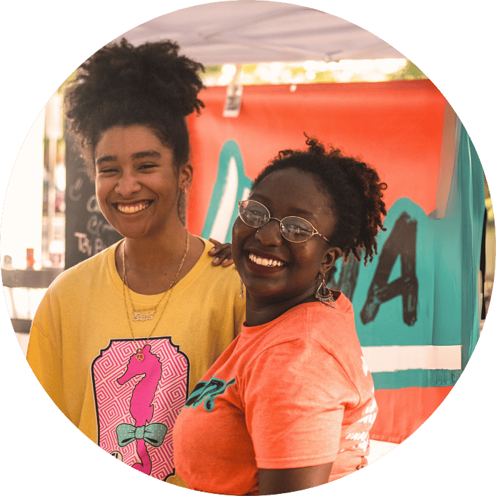 two african american teenagers smiling